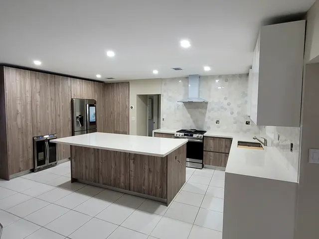 Walnut wood-grain kitchen cabinets with white island