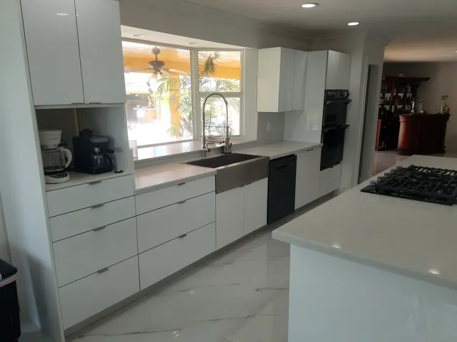 Bright white kitchen cabinets with quartz countertop